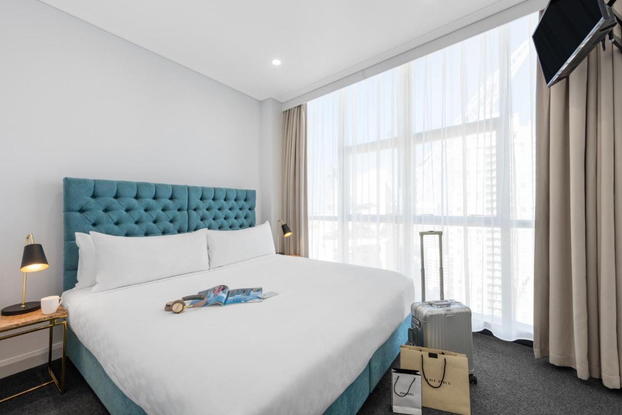 Meriton Suites Pitt Street, Sydney Ngoại thất bức ảnh A bedroom at the hotel